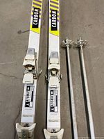 Photo showing both Atomic carbon skis side by side with bindings attached, displaying brand and Carbon labeling.