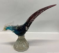 Side view of the glass pheasant showing the gradient tail, body, and textured base