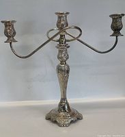 Front view of the WM A Rogers silver plated 3-arm candelabra showing overall shape and details.