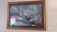 Full view of framed landscape print on wall