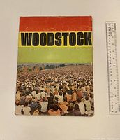 Front cover of the Woodstock special edition Life Magazine shows a large crowd with a red, yellow and green color band with the word 'WOODSTOCK'