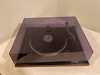 BSR Turntable with purple dust cover on, viewed from the front and side.