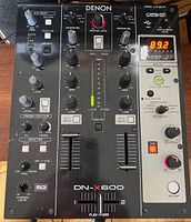 Front top view showing control knobs, faders, LED level meter, and effects unit on the right side with digital display and control buttons.