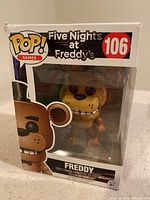 Front view of Funko POP! Games Freddy vinyl figure inside original box showing character design and box art.