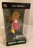 Front view of Jeff Spicoli Vinyl Idolz figure in clear box showing figure details and packaging.