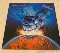Front cover showing the album artwork with a metallic fist smashing the earth, and the title 'Ram It Down' with Judas Priest logo in the top corners.
