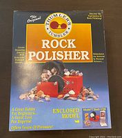 Front view of original box showing product name, image, and features