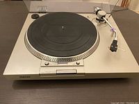 Front angled view of Sony turntable showing platter, tonearm, and control panel.