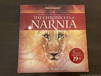 Front cover of The Chronicles of Narnia Radio Theater set showing lion artwork and set details.