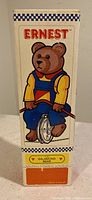 Photo of the front of the original box featuring Ernest The Balancing Bear illustration