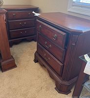 Pair of nightstands positioned side by side showing fronts and sides