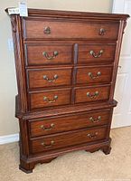 Front view showing overall shape, drawer layout and hardware.