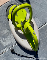 Top view of the Garden Groom Safety Midi Hedge Trimmer showing green and gray body and power cord.