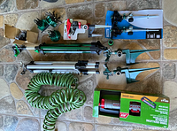 Overview of assortment of garden sprinklers and accessories, including turbo sprinklers, hose, and connectors