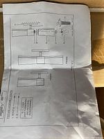 Instruction sheet showing fixture assembly overview and part layout diagrams for a ceiling light fixture.