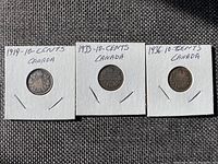 Three Canadian dimes from 1919, 1933, and 1936 in labeled white cardboard holders.