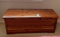 Front view of cedar chest with hinged lid closed