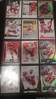 Twelve Nicklas Lidstrom hockey cards in three-pocket pages, showing front images of the cards.