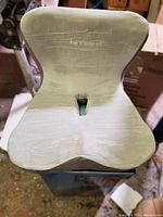 Front view of the Dr Med seat cushion showing its contoured ergonomic shape and central pressure relief cut-out.