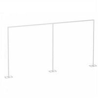 Full front view of the metal background frame with three vertical supports and four base plates on the floor.