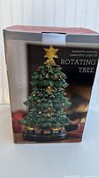Front view of box with image of the animated rotating fiber optic Christmas tree and product title.