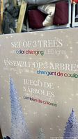 Box front showing text 'Set of 3 Trees with color changing LED lights' in multiple languages.