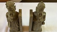 Pair of soapstone Chinese warrior bookends shown side by side