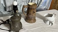 Full lot showing teapot table lamp, German beer stein, and three white porcelain scoops
