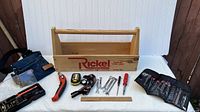 Overview of the wooden Rickel toolbox and assorted hand tools laid out, showing condition and variety of tools included.