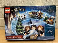 Front of LEGO Harry Potter Advent Calendar box showing minifigures, Christmas tree, Hogwarts train and Privet Drive sign with set number 76390 and piece count 274