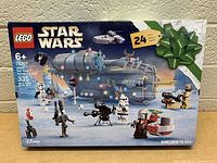Front of Lego Star Wars Advent Calendar box showing the main scene and minifigures included
