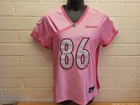 Front view of pink Pittsburgh Steelers women's jersey size XL, showing number 86 and Steelers logo.