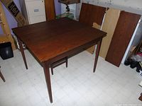 Assembled table with two leaves inserted, side view