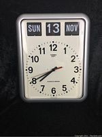 Front view of TWEMCO clock showing time and calendar details.