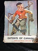 Cover of Eaton's of Canada Fall and Winter 1948-1949 catalog featuring a boy in vintage hockey goalie gear.