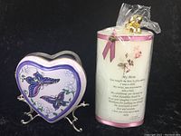 Purple ceramic heart shaped box with butterfly design and decorative candle with floral pattern and poem 'My Mom'