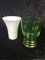 Front view of green and white glass vases showing side by side size and details