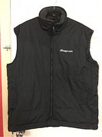 Front view of the black Snap-On winter vest showing the zipper, high collar, and Snap-On logo on left chest.