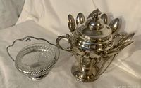 Photo of the spoon holder with covered sugar bowl and separate glass sugar bowl with silver-plated handle, showing condition and arrangement.