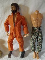 Front view of G.I. Joe figure in orange suit with hair and beard next to second torso with camo pants
