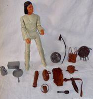 Full view of Geronimo Apache action figure with arranged accessories showing variety and scale.