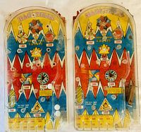 Two vintage Bagatelle pinball game playfields side by side showing colorful scoring targets and graphics
