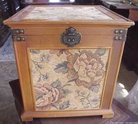 Front and top view of the wooden square storage box showing floral fabric inlays and corner hardware.