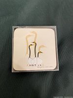 Single square coaster featuring stylized birds by Benjamin Chee Chee, artist signature visible.