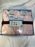 Photo of unopened spa set showing all items inside clear packaging with labels