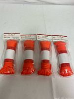 Front view of four packs of Outbound nylon paracord, tightly bundled, sealed in plastic with white bands and header card showing brand and product name.