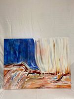 Frontal image showing full abstract painting with flowing brushwork in white, brown, blue, and red colors.