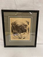 Framed sketch portrait of pug dog with artist signature and title.