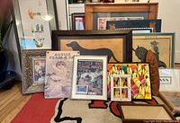 General view of multiple framed art prints in various sizes and designs including animals, schoolhouse, and vintage themes