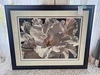 Full view of framed floral print showing a large white flower with detailed petals.
